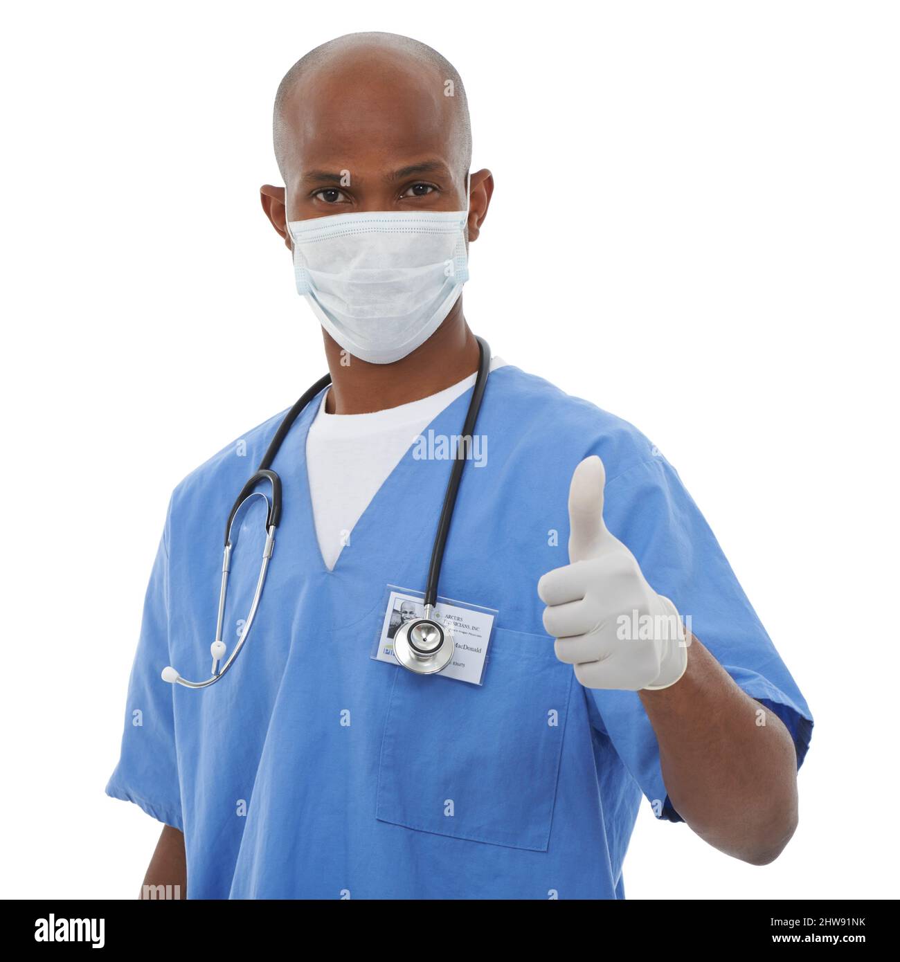 Tu salud es perfecta. Un doctor que muestra un pulgar para arriba mientras que aislado en blanco. Foto de stock