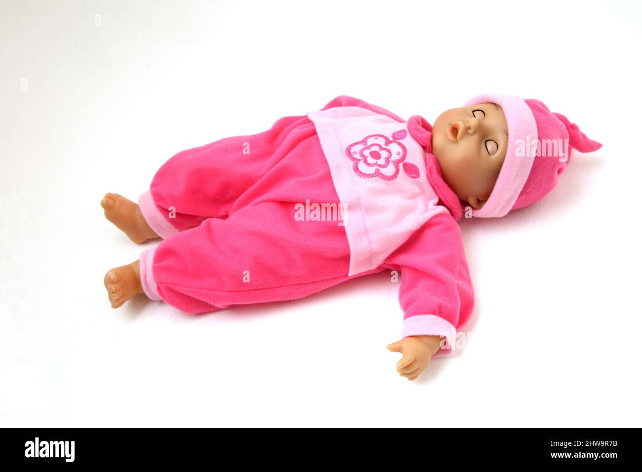 Juguete Francés baby Doll Ponga con los ojos cerrados y usando Babygrow  Rosa y Sombrero Fotografía de stock - Alamy