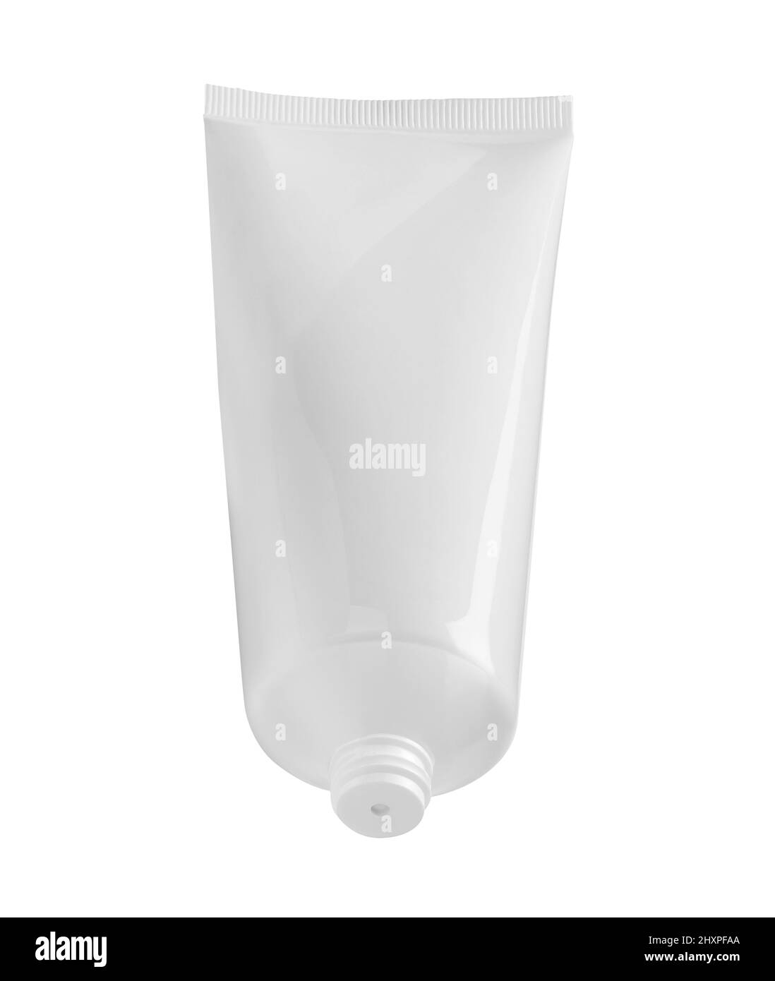primer plano de una crema de belleza blanca o un tubo de pasta dental sobre fondo blanco Foto de stock