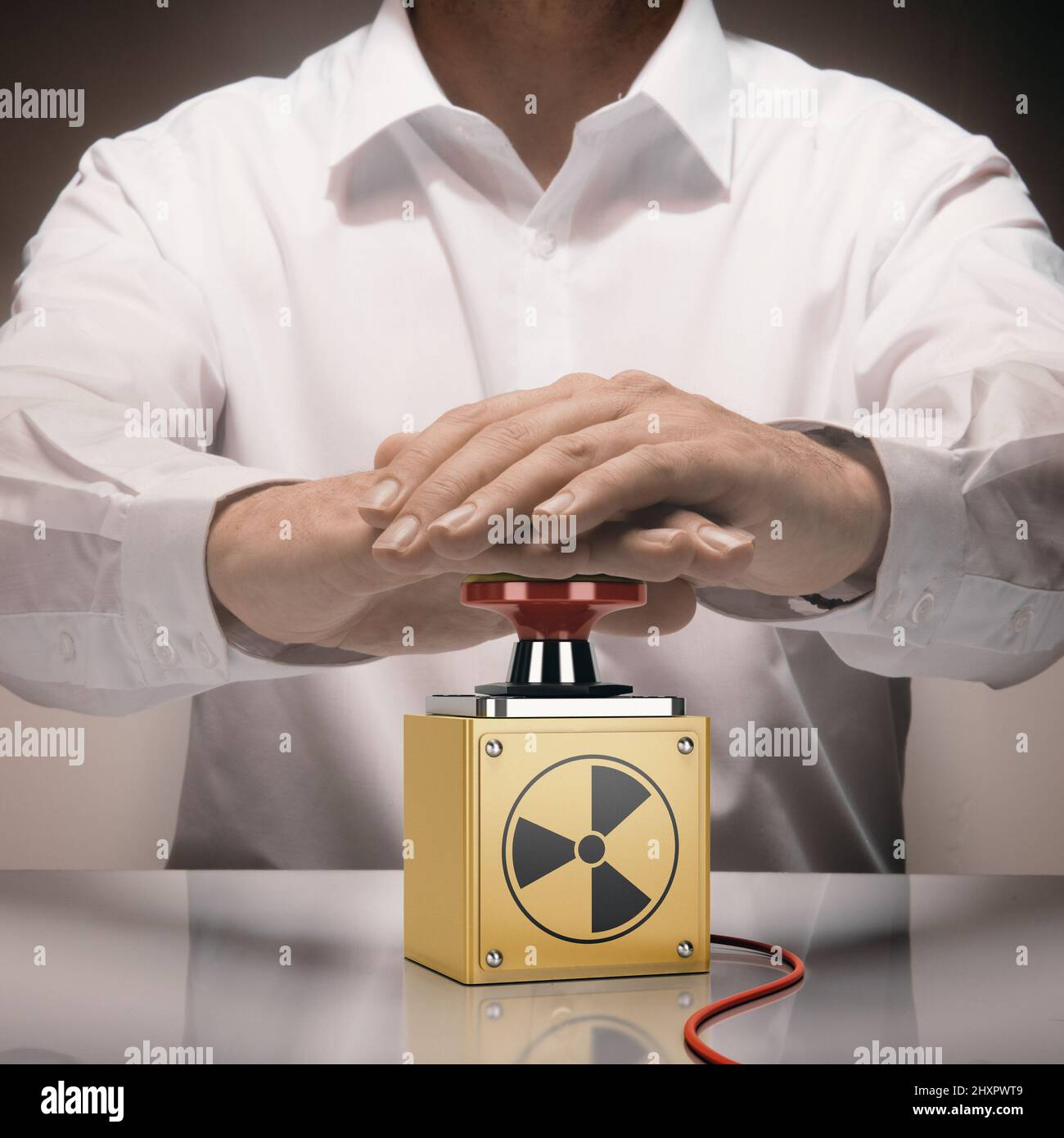 Hombre pulsando un botón de nuke. Concepto de guerra nuclear. Imagen compuesta entre una fotografía de mano y un fondo de 3D. Foto de stock