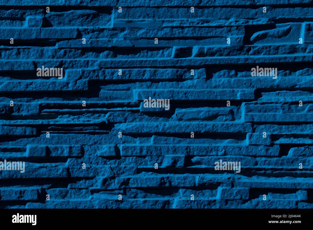 Textura de fondo de pared de piedra estrecha azul Foto de stock