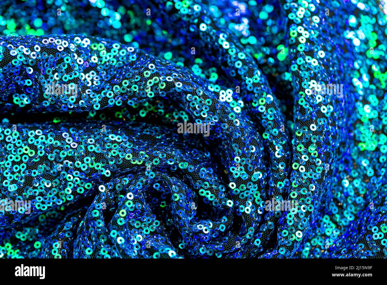 Lentejuelas texture.Green blue lentejuelas background.Traje de color azul brillante y verde. Tejido y bordado Foto de stock