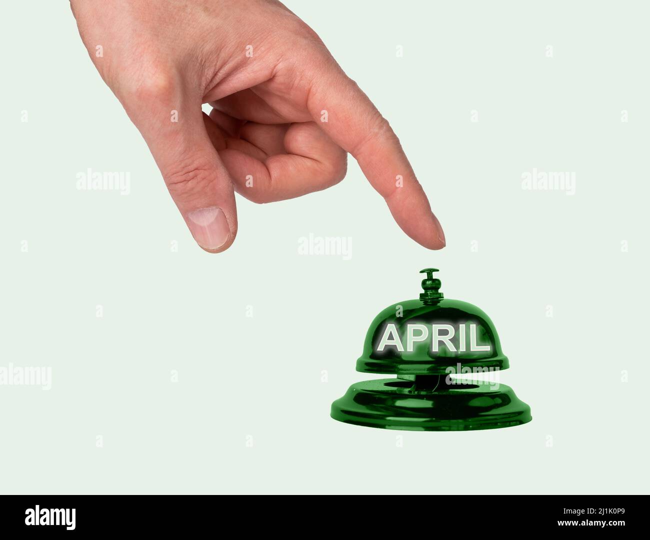 Abril, a partir del mes de primavera. Mano, botón que pulsa con el dedo. Fotografías de alta calidad Foto de stock