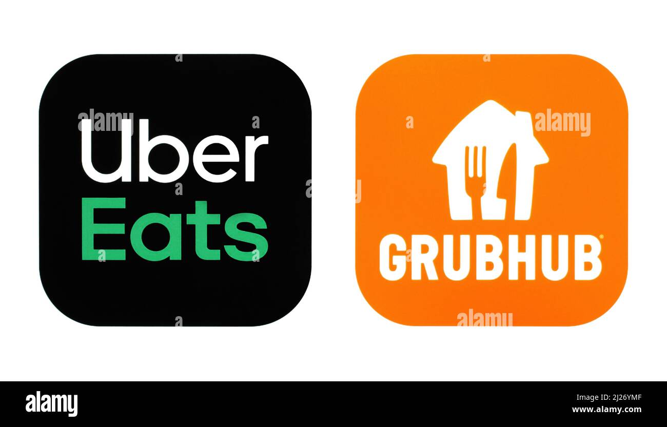 Kiev, Ucrania - 08 de febrero de 2022: Conjunto de iconos de Popular Food Apps, impreso en papel: Uber Eats y GrubHub Foto de stock