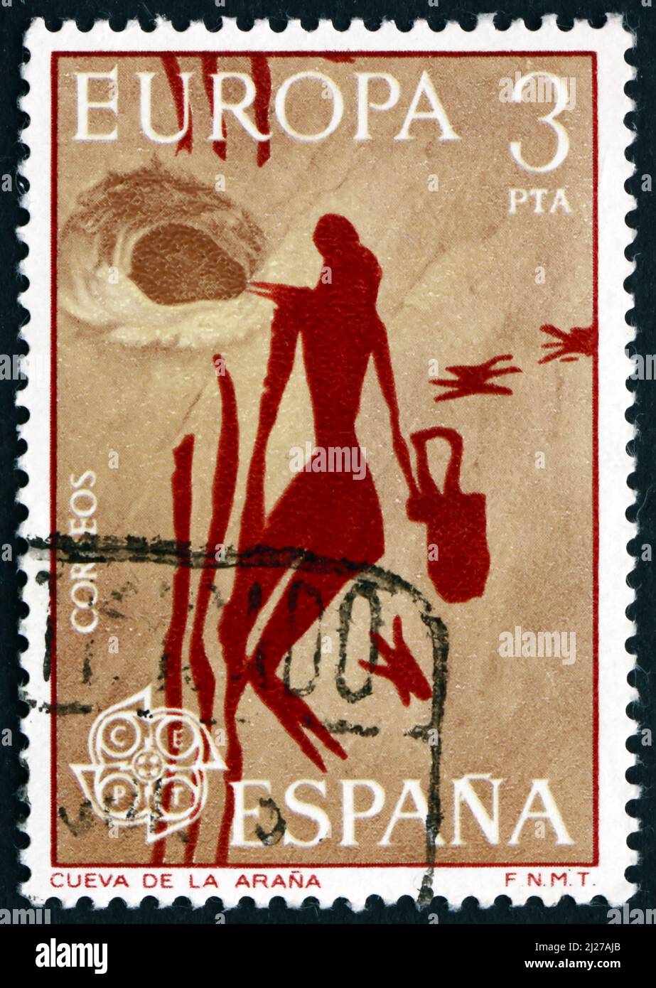 ESPAÑA - CIRCA 1975: Un sello impreso en España muestra a la Mujer Gathering Miel, Mesolítico Rock Painting de la Cueva de Arana, España, circa 1975 Foto de stock