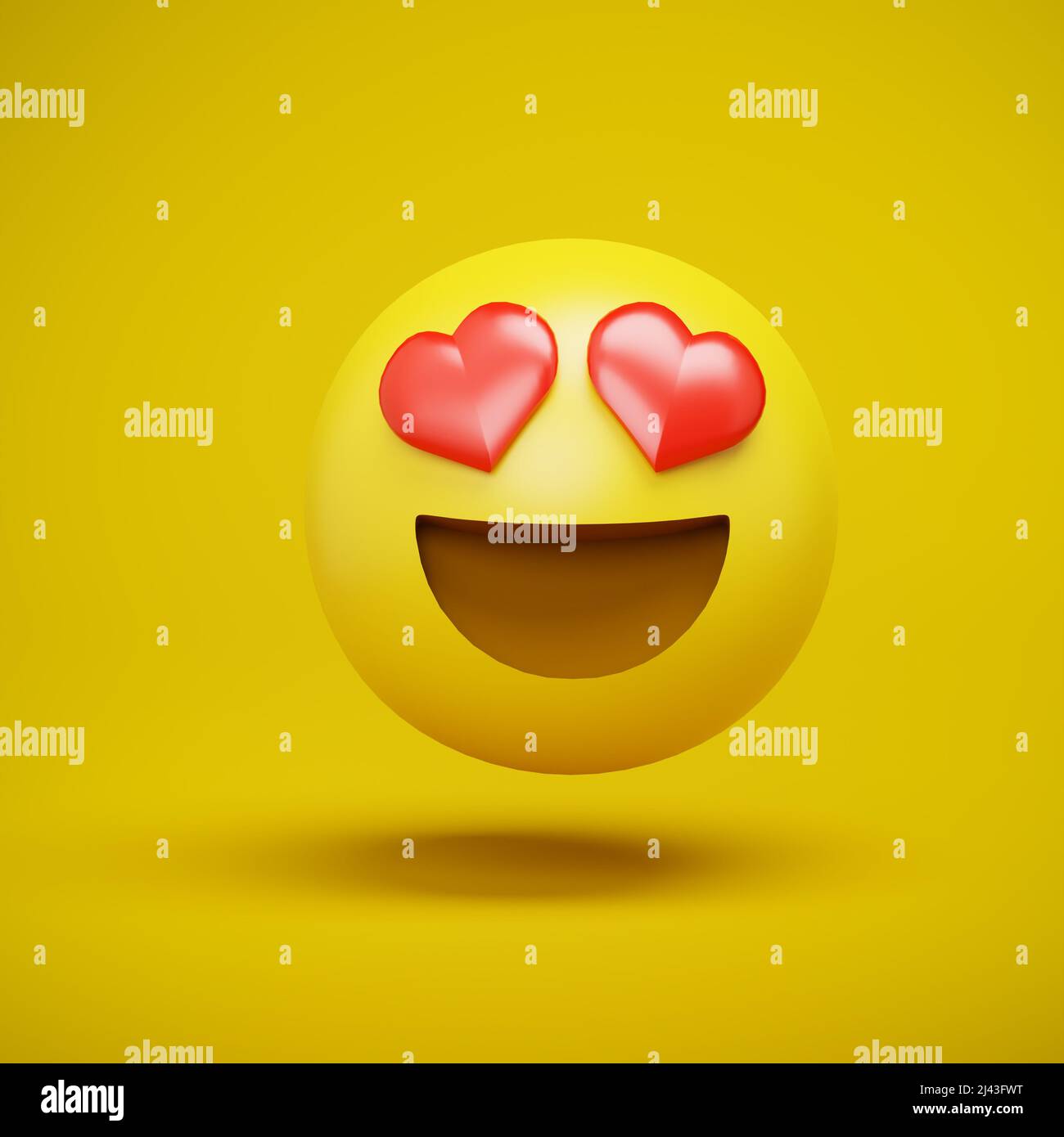 3d render de un emoji emoticono con corazones rojos como ojos. Ojos del corazón - cara del corazón. Concepto de amor Foto de stock