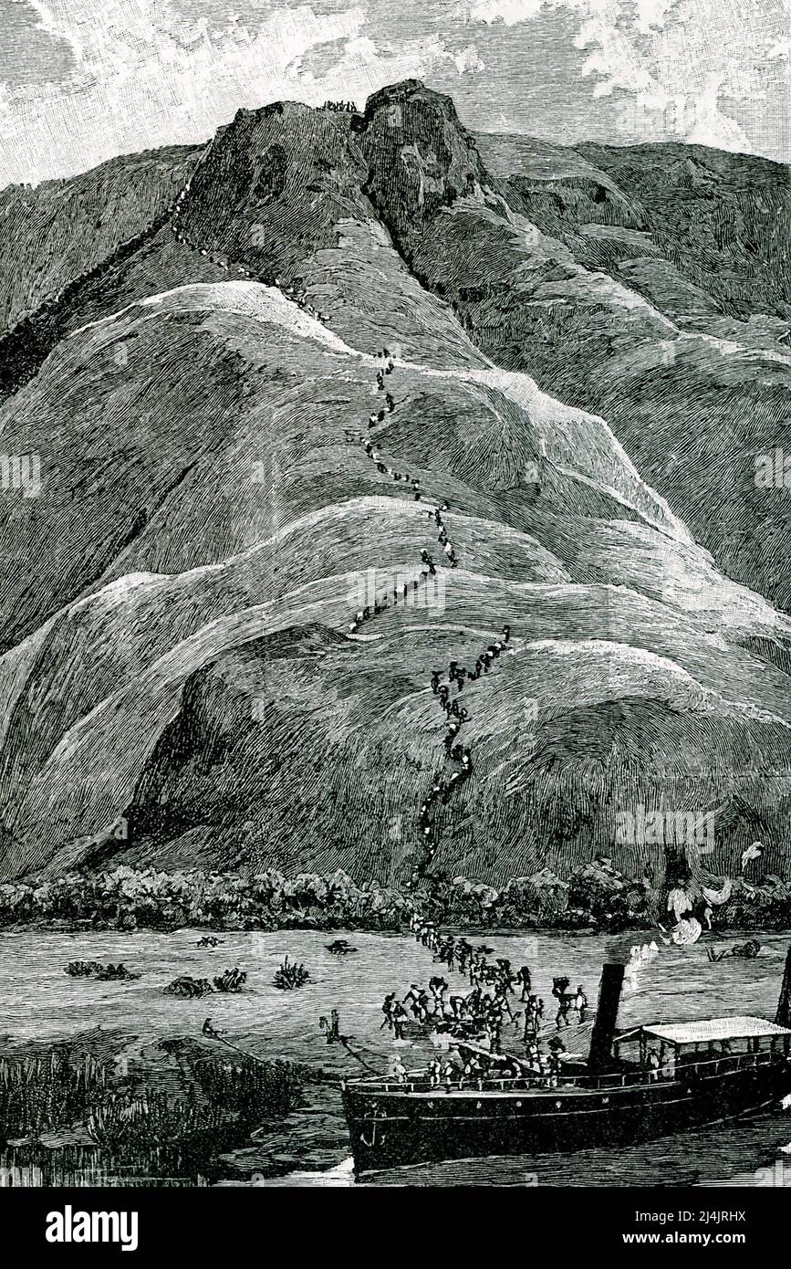 El título de 1890 dice: ' Escalando las laderas de la meseta.' Es del libro de H M Stanley, In Darkest Africa. Sir Henry Morton Stanley (1841-1904) fue un explorador y periodista británico. En 1871, el New York Herald lo envió a África para encontrar a David Livingstone. En la expedición de 1879-1884, obtuvo concesiones territoriales que condujeron a la adquisición belga del Estado Libre del Congo. Foto de stock