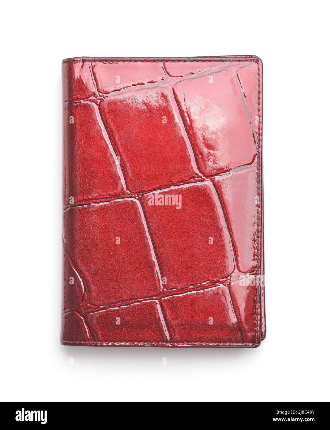 Vista frontal del soporte de la tarjeta de identificación de cuero rojo brillante aislado en blanco Foto de stock