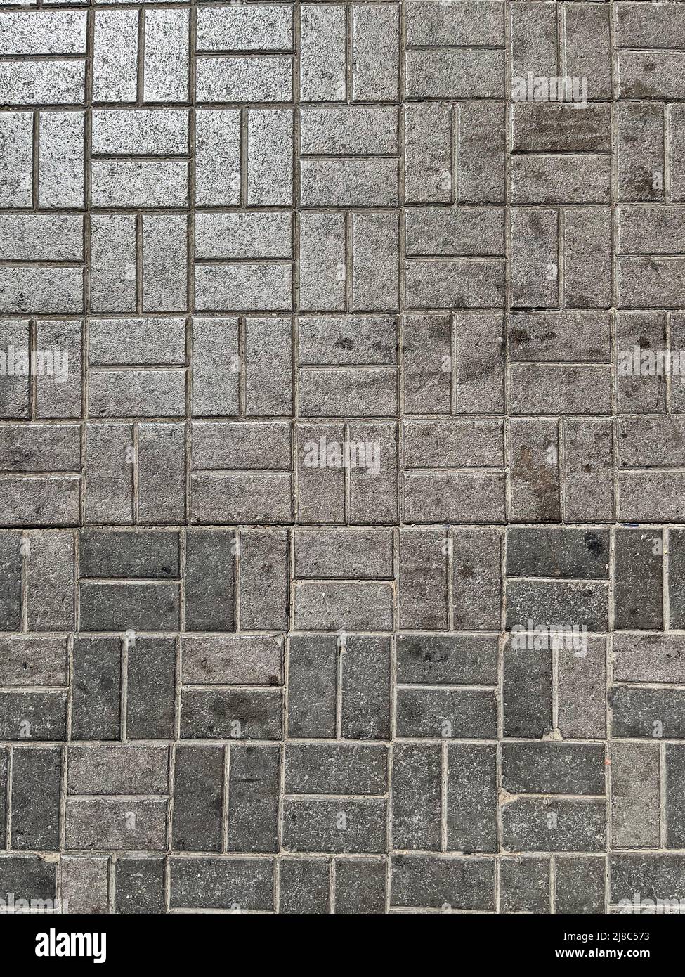 textura fondo de losas de pavimentación de calles sucias grises de forma rectangular. Foto de stock
