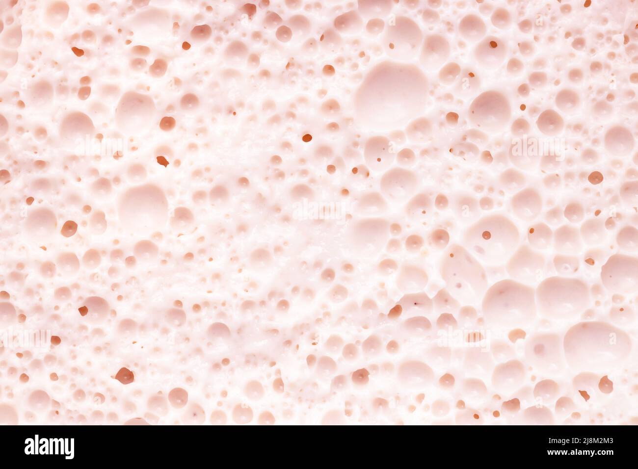 Textura rosa pastel de crema de humedad con burbujas. Foto de stock