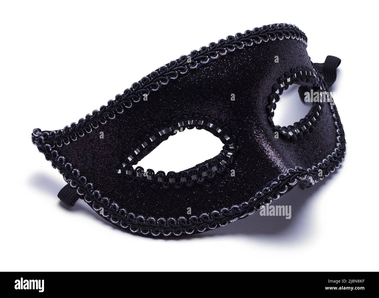 Máscara de bola negra veneciana cortada sobre blanco. Foto de stock