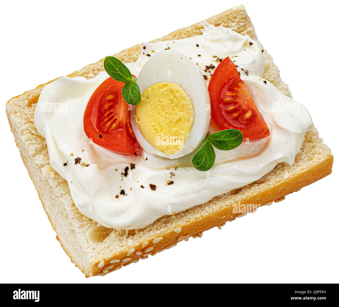 Baguette con queso crema aislado sobre fondo blanco, vista superior Foto de stock