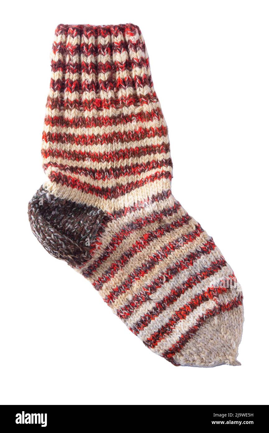 Calcetines de punto de hilos de lana. Abrigados calcetines caseros de invierno a rayas coloridas Fotografía de stock -