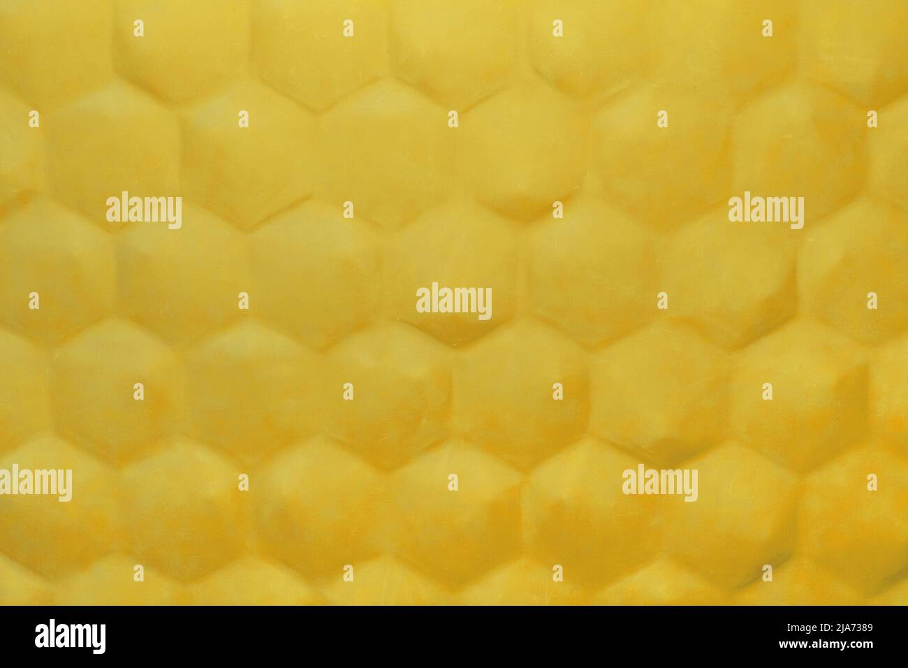 Patrón de panal abstracto amarillo fondo hexagonal geométrico diseño de pared interior moderno. Foto de stock