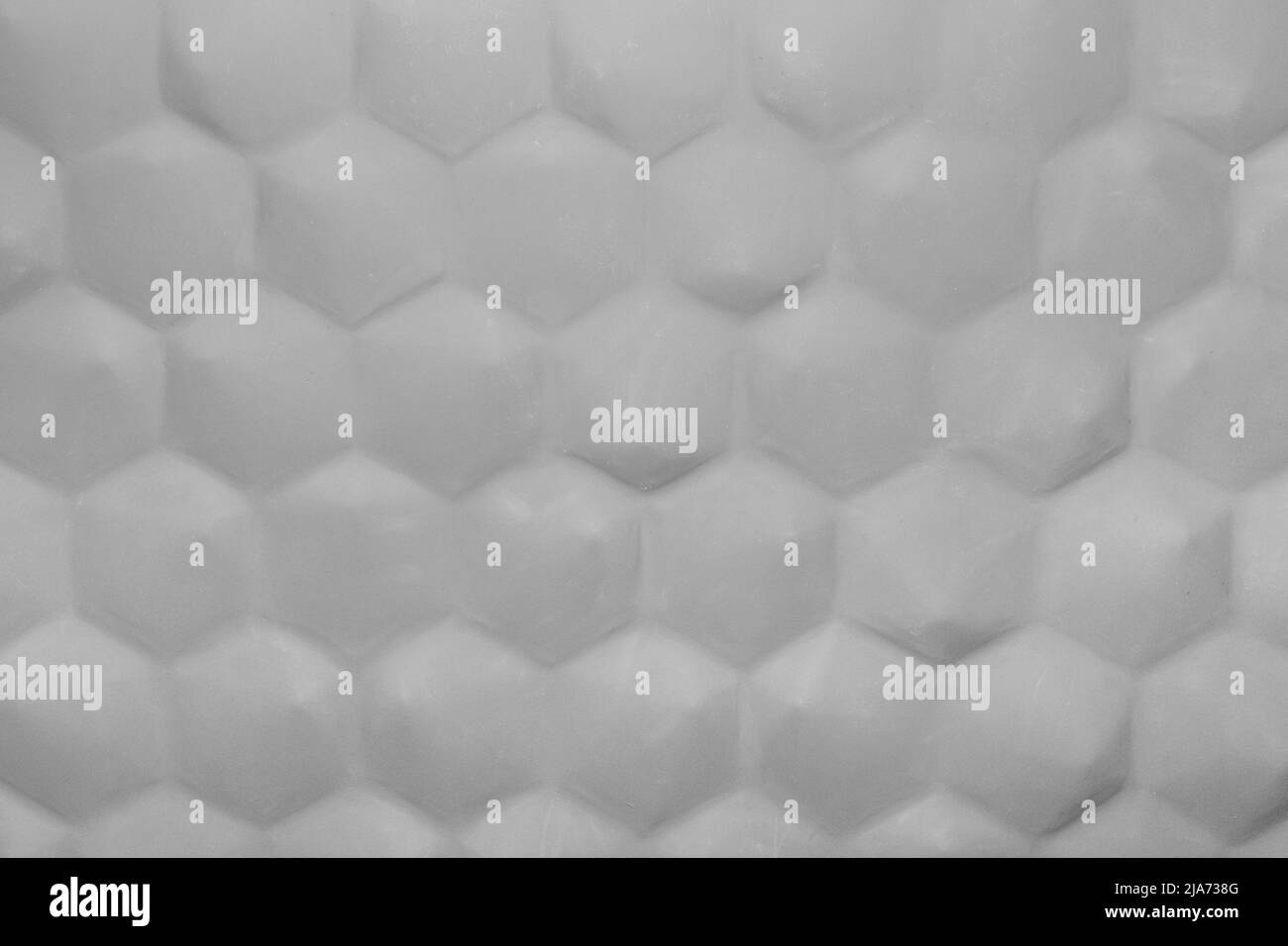 Patrón de panal abstracto gris blanco fondo hexagonal forma geométrica diseño de pared interior moderno. Foto de stock