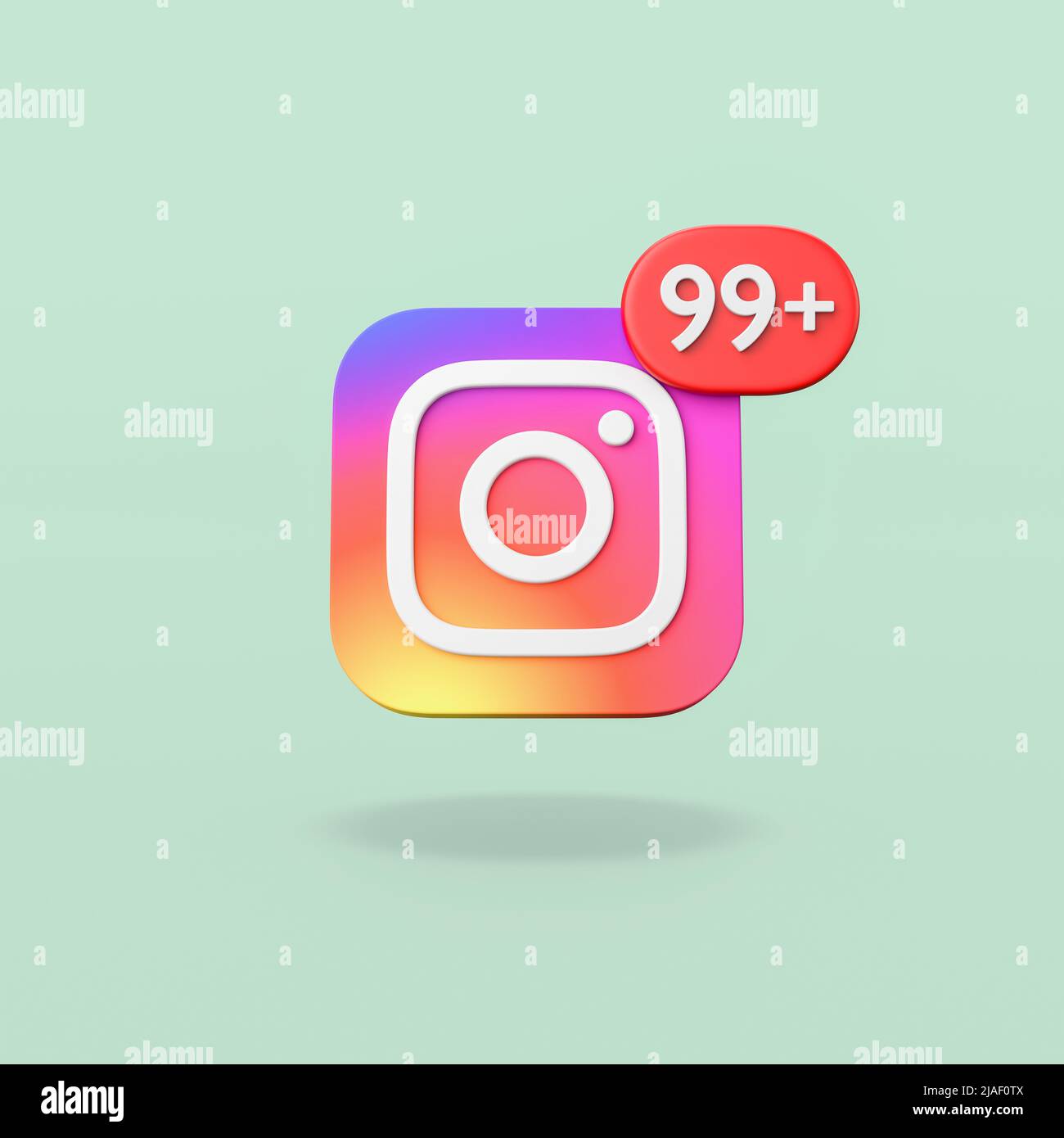 Logotipo de Instagram con notificación de 99 sobre fondo verde Foto de stock