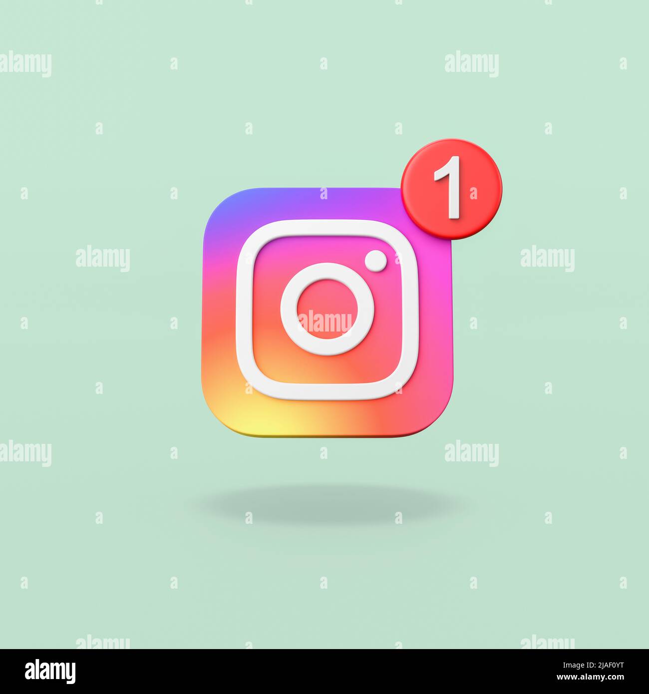 Logotipo de Instagram con notificación de 1 sobre fondo verde Foto de stock