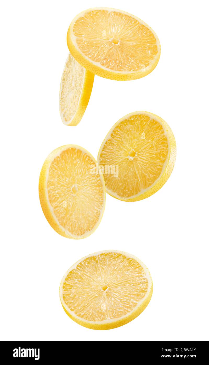 caída de rodajas de limón con ruta de corte aislada sobre un fondo blanco. Foto de stock