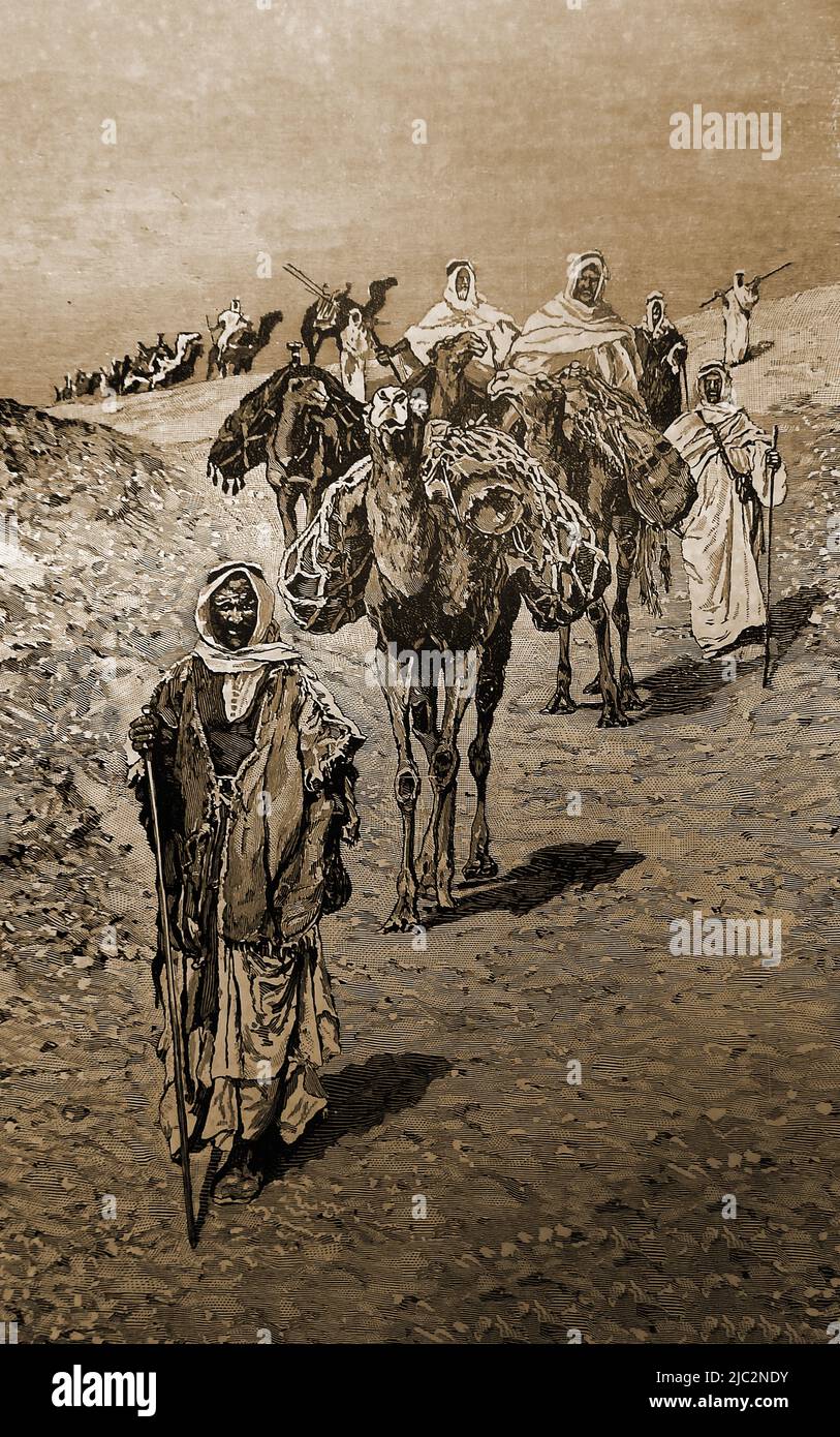Un grabado en inglés de una ilustración de finales del siglo 19th que muestra a los árabes dirigiendo una caravana de camellos en el desierto Foto de stock