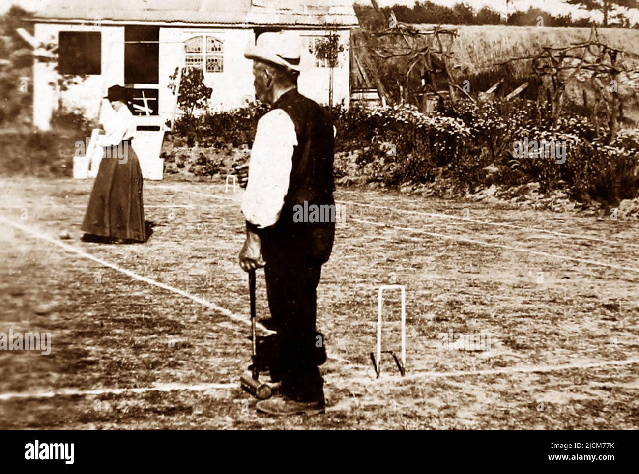 Jugando croquet, posiblemente 1870s Foto de stock