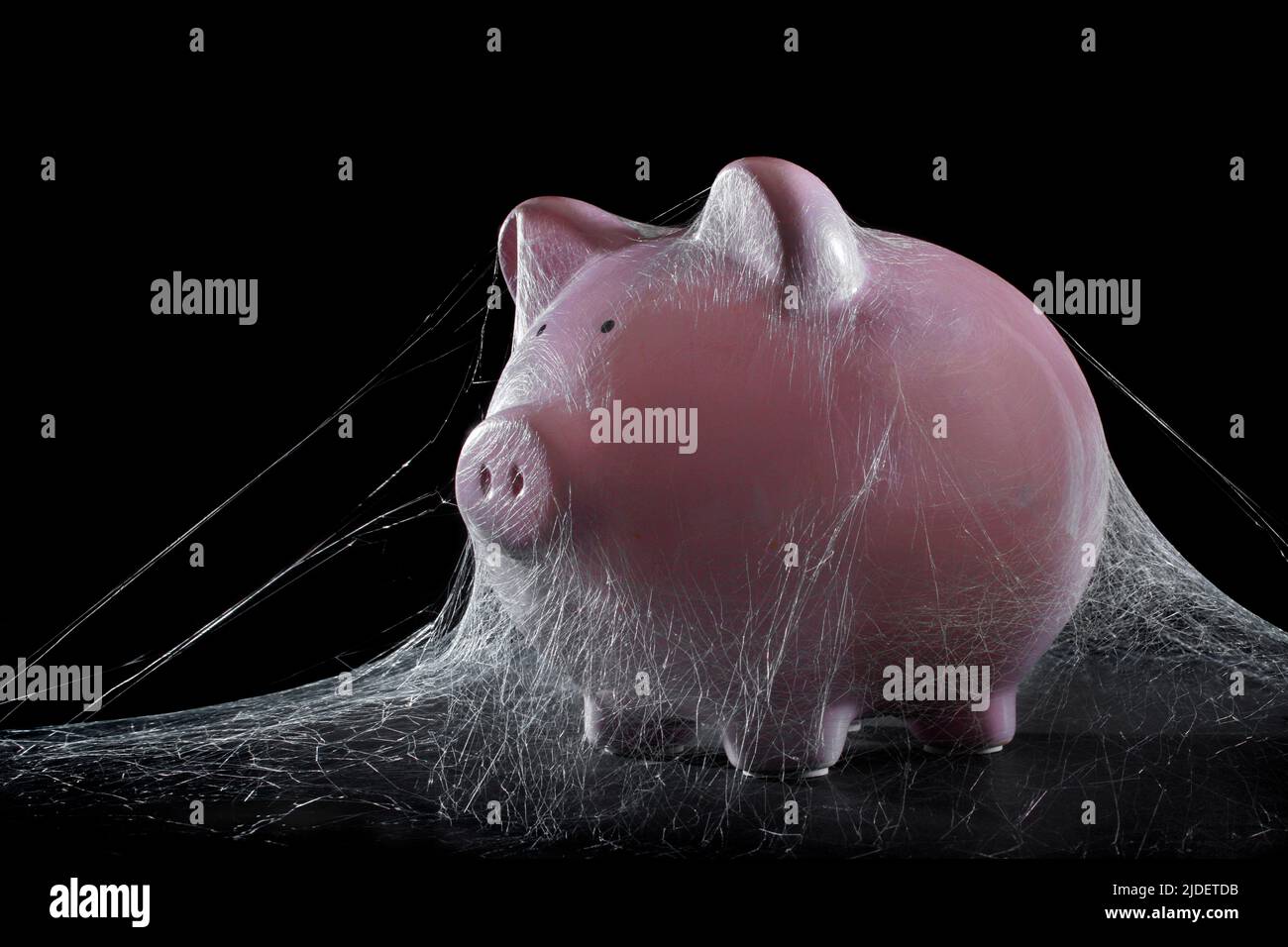 Banco Piggy con telarañas Foto de stock