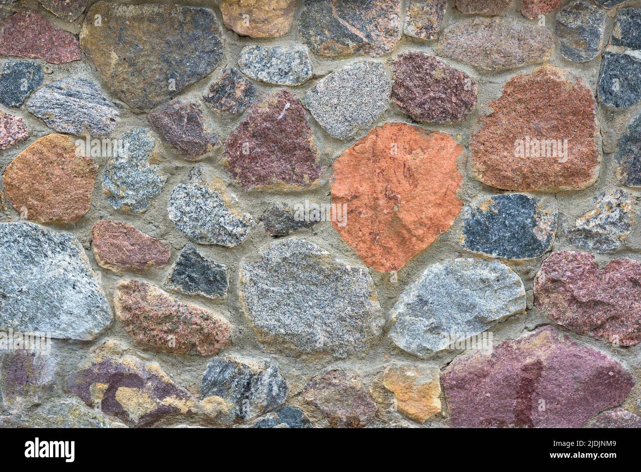 Fondo o textura de pared de piedra de colores Foto de stock