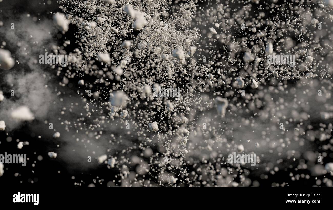 desechos voladores con polvo sobre fondo negro, primer plano Foto de stock