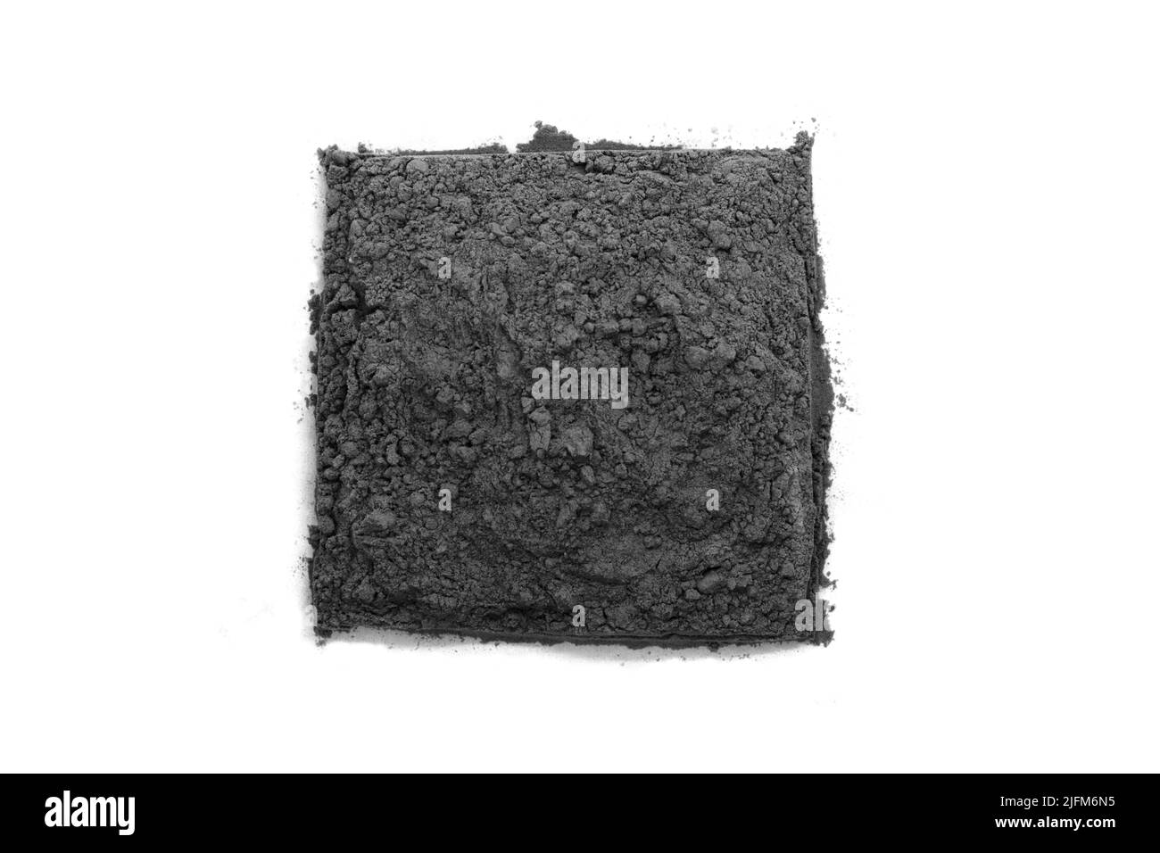 Cuadrado negro polvo de arcilla cosmética - vista superior Foto de stock