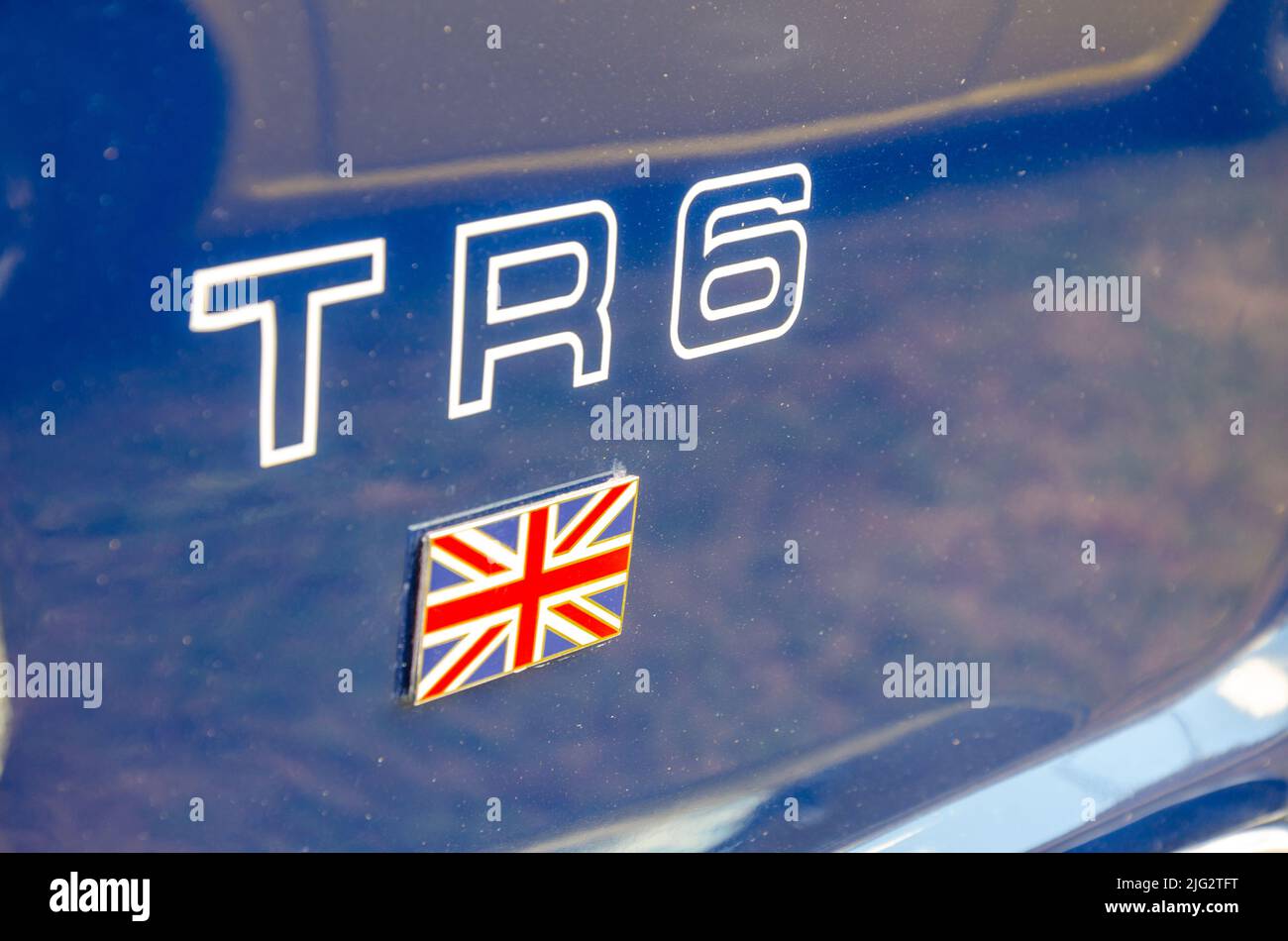 Primer plano de detalle en el lateral de un Truimph TR6 azul en el Berkshire Motor Show de Reading, Reino Unido Foto de stock