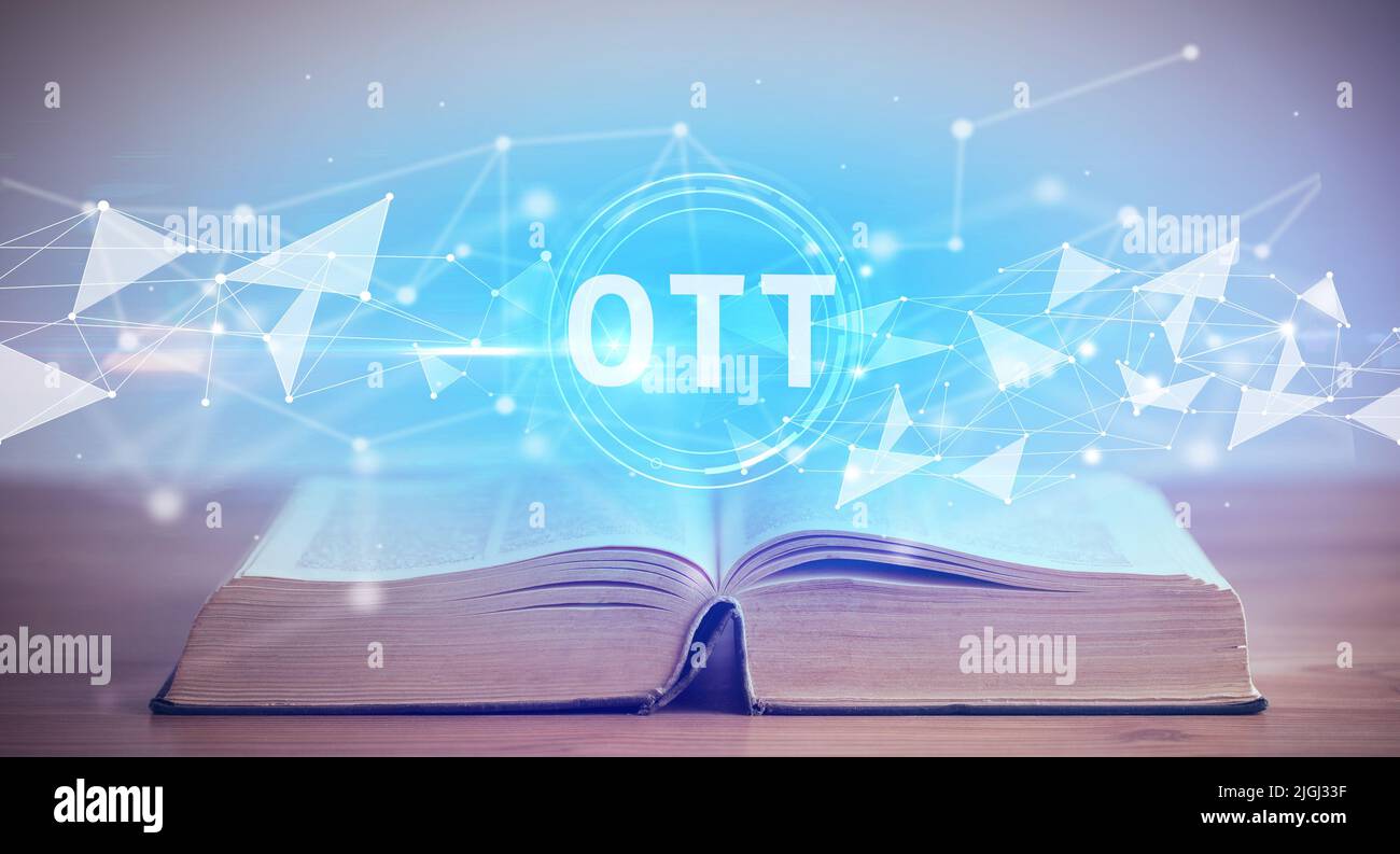 Libro abierto con abreviatura OTT, concepto de tecnología moderna Foto de stock
