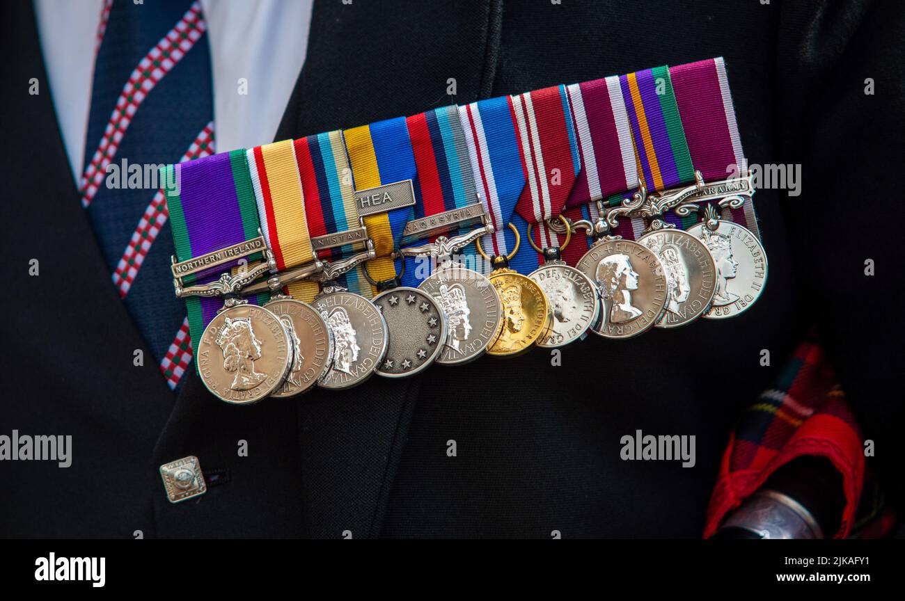 Grupo de medallas usadas por un veterano del ejército británico de los propios conquistadores escoceses del rey Foto de stock