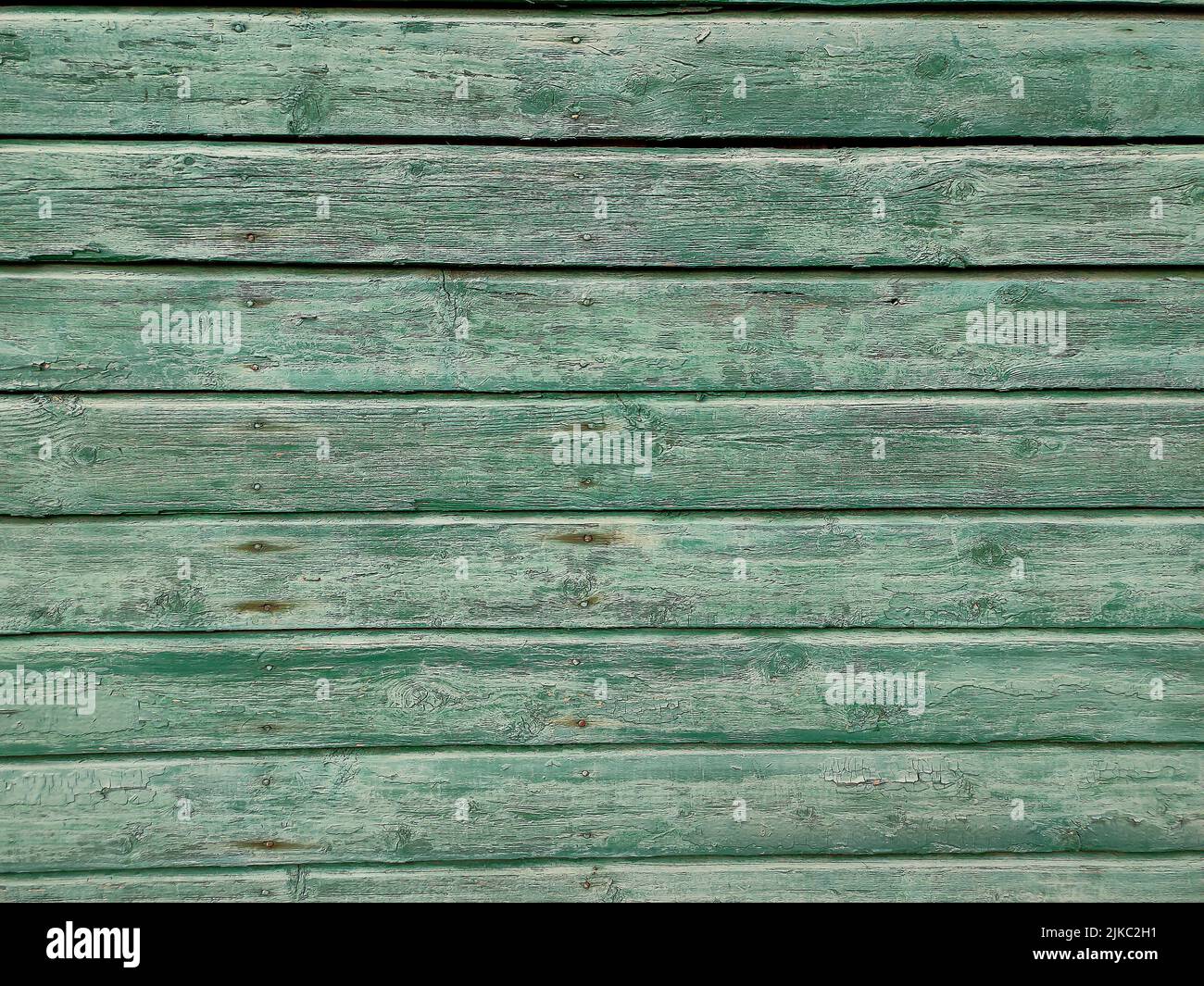 Fondo de madera con pintura vieja, pared de madera verde de tablones Foto de stock