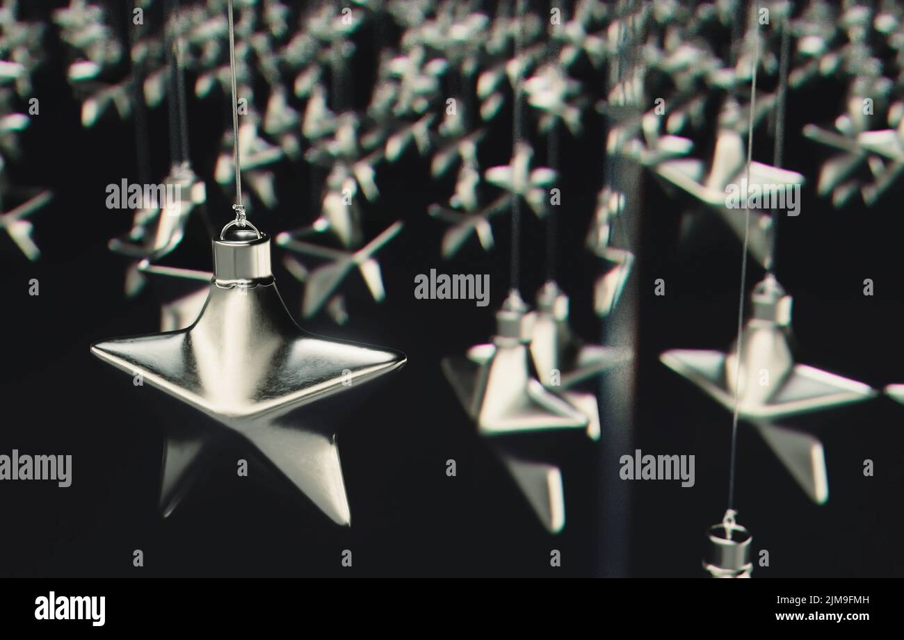 Una colección de decoraciones plateadas en forma de estrella de navidad sobre un fondo aislado - 3D render Foto de stock