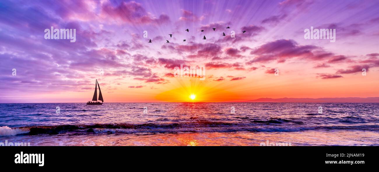 Un velero está navegando a lo largo del océano mientras los rayos del sol estallan adelante en estilo de la imagen de la bandera Foto de stock