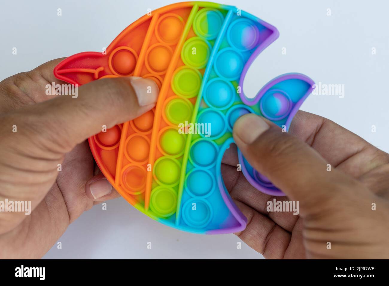 Jugar colorido anti-estrés sensorial pop it juego Foto de stock