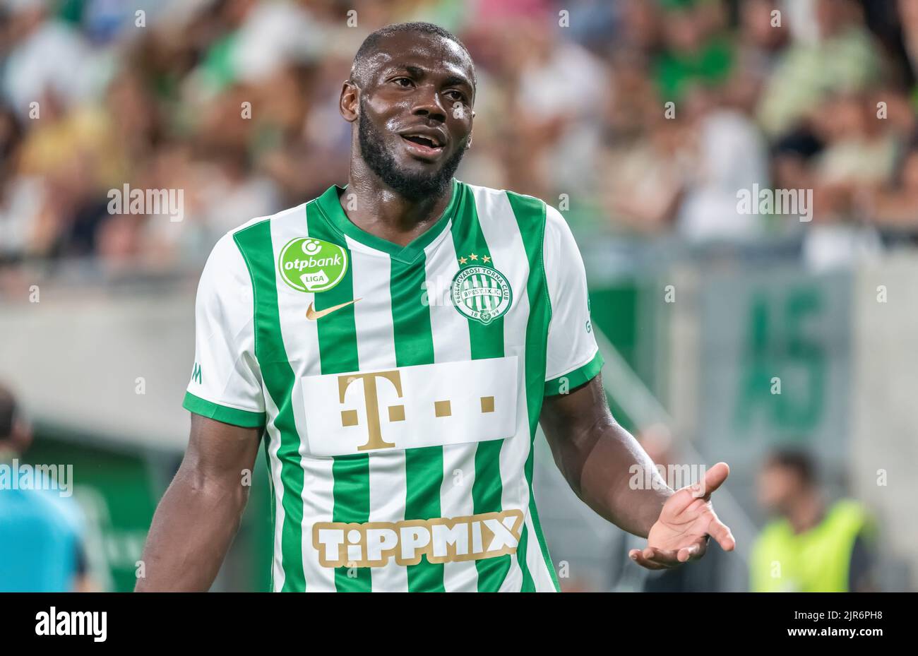 Anderson Esiti of Ferencvarosi TC challenges Luis Jakobi of Ujpest