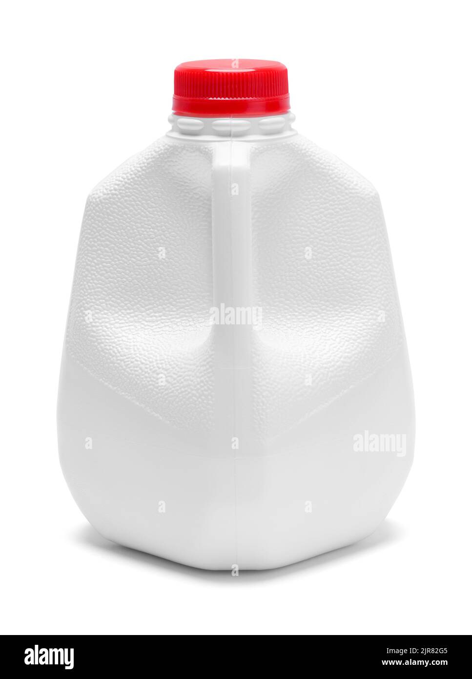 Jarra de leche de plástico cortada en blanco. Foto de stock