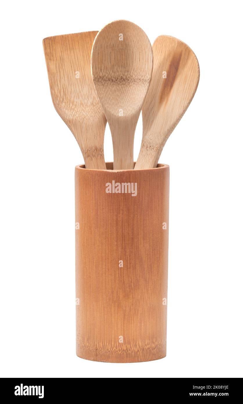 Soporte para utensilios de cocina con cucharas de madera y espátula aislada sobre blanco Foto de stock