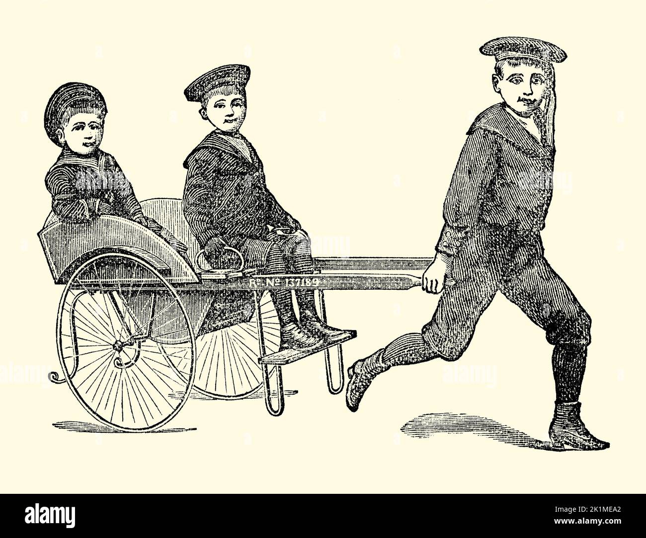 Un antiguo grabado victoriano de un carruaje “Victor”, realizado por Marris y Cooke of Grimsby, East Yorkshire, Inglaterra, Reino Unido. Es de un libro de 1890. El carro de dos plazas tirado a mano estaba dirigido a los niños. Foto de stock
