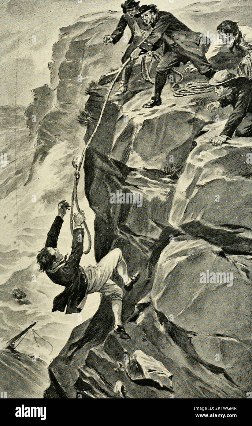 Una Escapada Estrecha - Así como el escalador se acercaba a la cima del acantilado, la roca dio paso. Desesperado, arrojó sus brazos y afortunadamente agarró la cuerda Foto de stock
