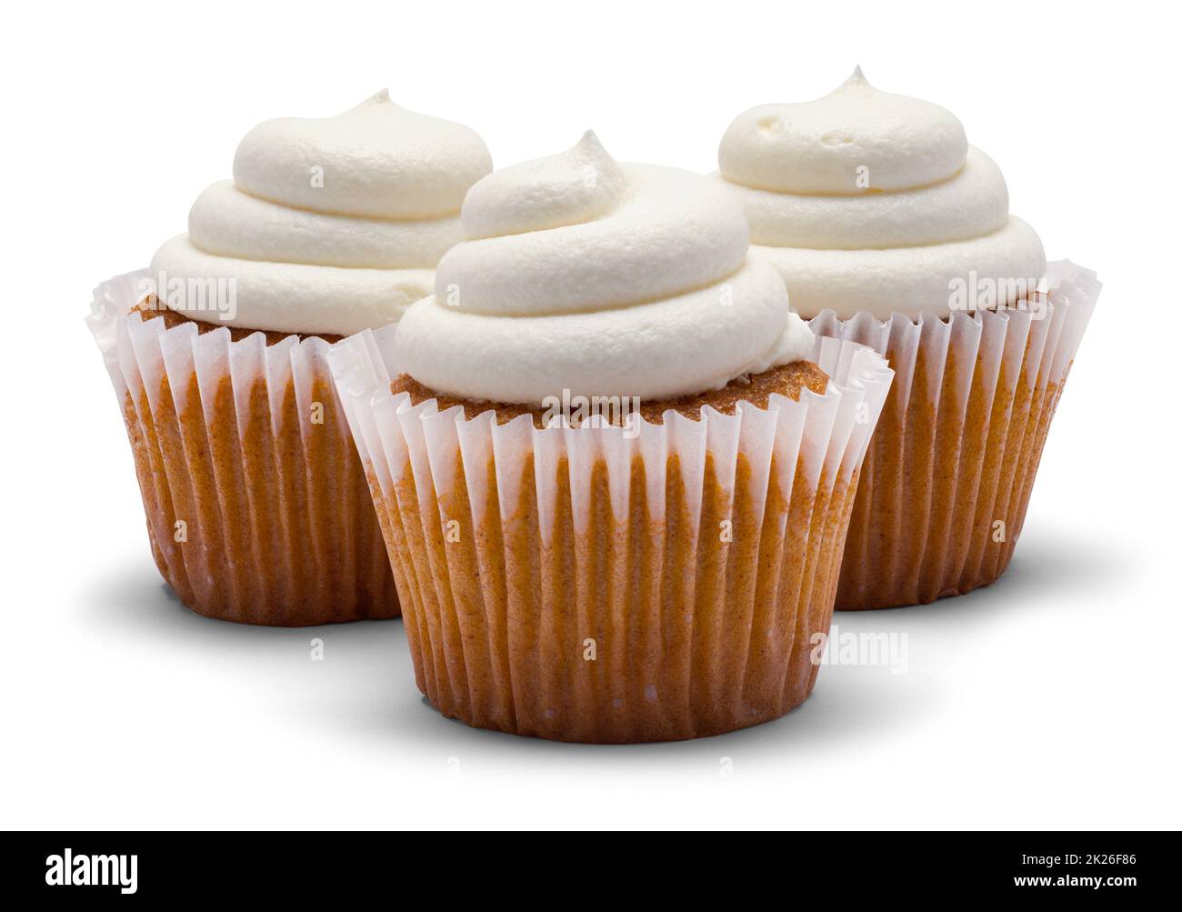 Tres Cupcakes con corte de espiral espumosa. Foto de stock