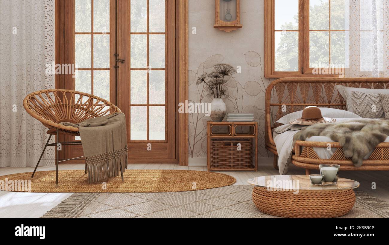 Boho elegante habitación de granja con cama de ratán y muebles de madera.  Alfombra de yute y decoración en tonos blancos y beige. Papel pintado  vintage, interio bohemio Fotografía de stock -