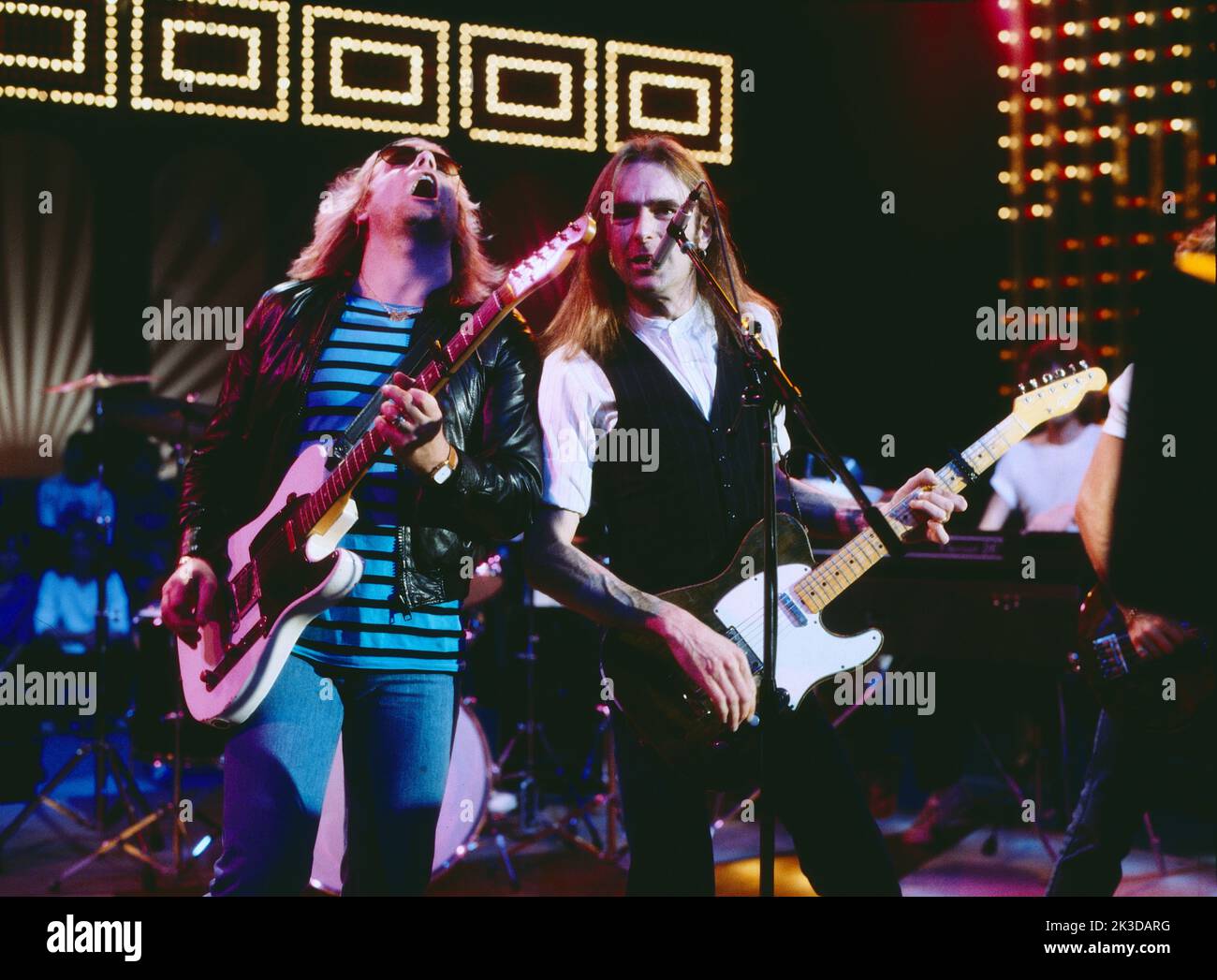 Status quo, Britische Rock Band, TV Auftritt, Deutschland, alrededor de 1984. Status quo, grupo de rock británico, actuación de TV, Alemania, alrededor de 1984. Foto de stock
