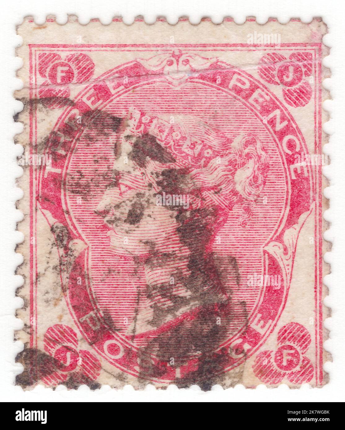 REINO UNIDO - 1862: Un sello de franqueo de color rosa pálido de 3 pence que muestra el retrato de la reina Victoria Foto de stock