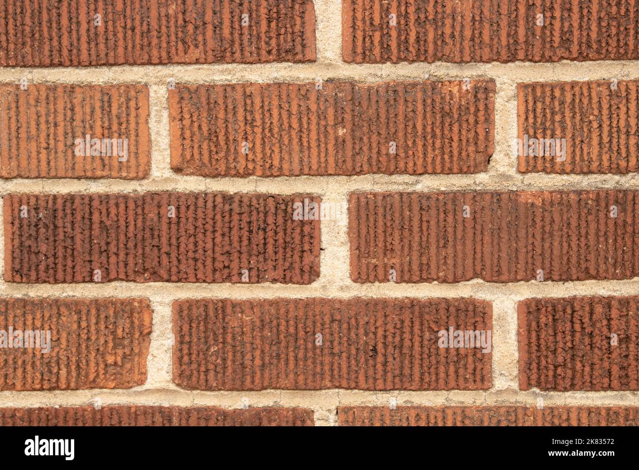 Primer plano de fondo de pared de ladrillo marrón rojizo Foto de stock