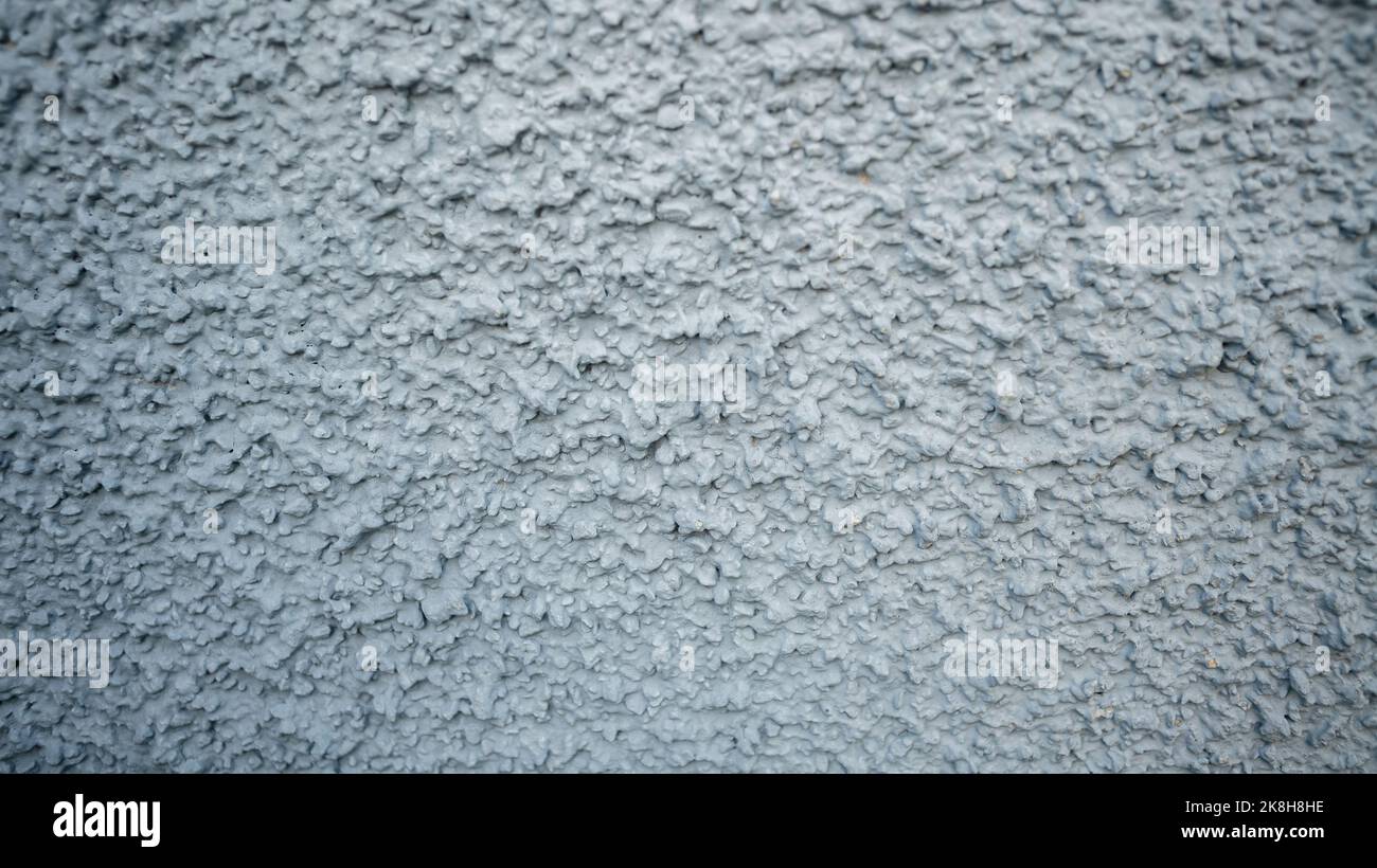 Fragmento abstracto de alto detalle de fondo gris de pared de goteo. Cerrado de papel pintado de piedra gris cemento. Textura urbana de piedra vieja y grungy Foto de stock