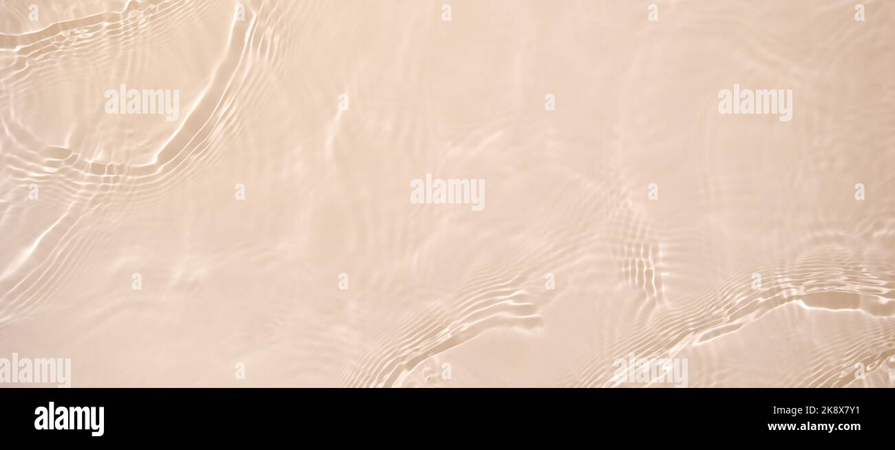 banner de fondo beige transparente textura de superficie de onda de agua clara Foto de stock