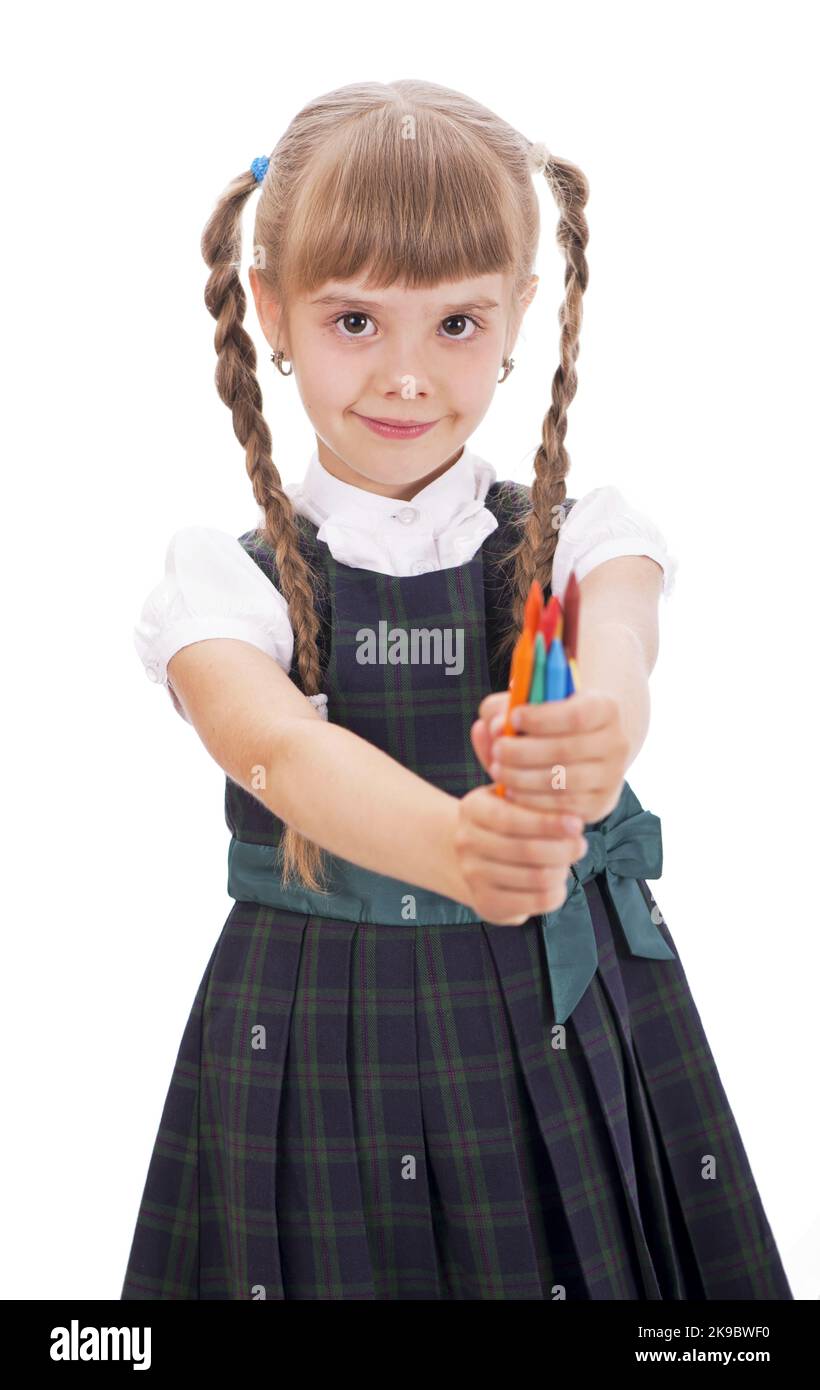 Chica Con Auriculares. Niña En Uniforme Con Clase Come Piruleta. Fotos,  retratos, imágenes y fotografía de archivo libres de derecho. Image  149593503