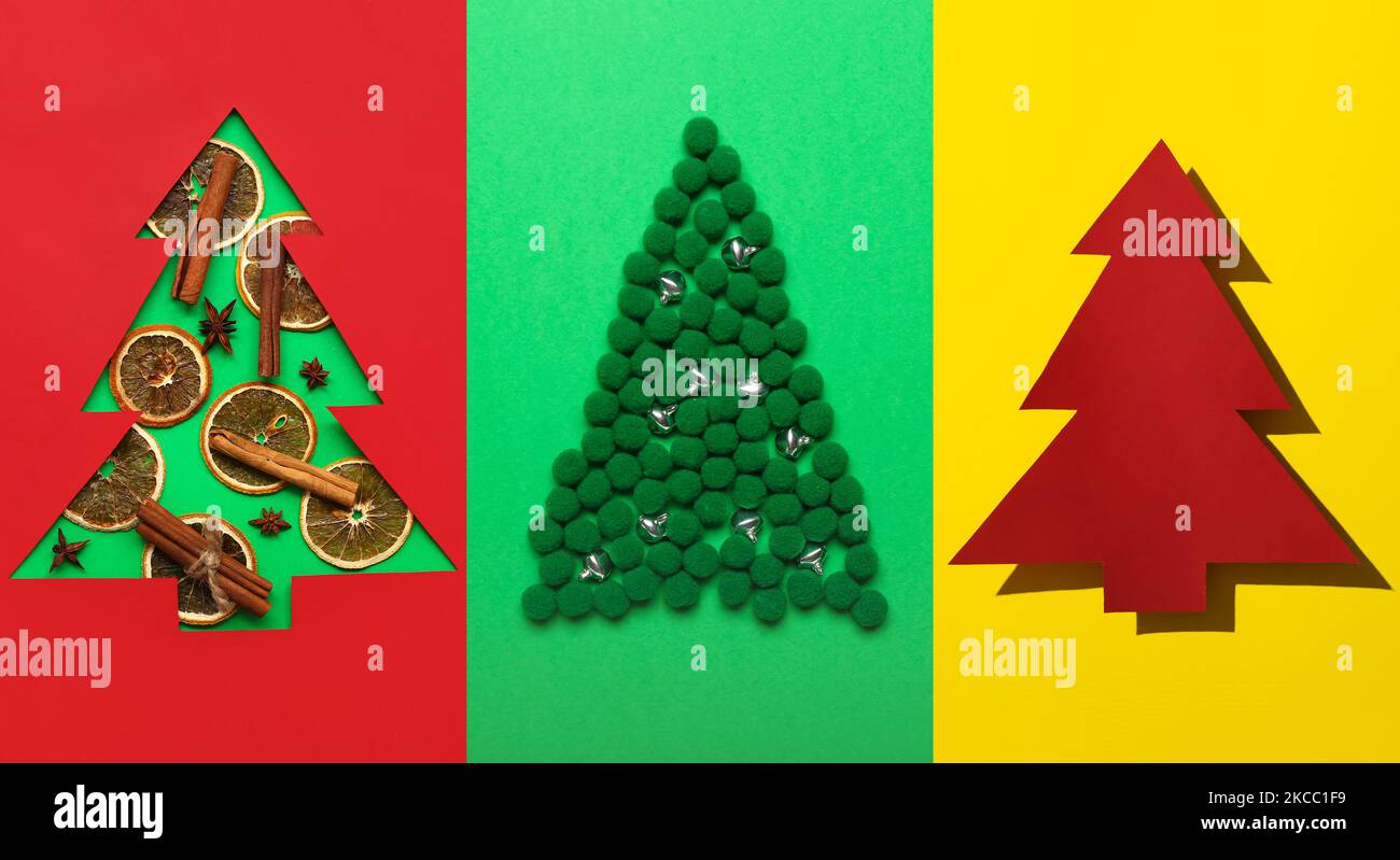 Conjunto de diferentes árboles de Navidad creativos sobre un colorido fondo Foto de stock