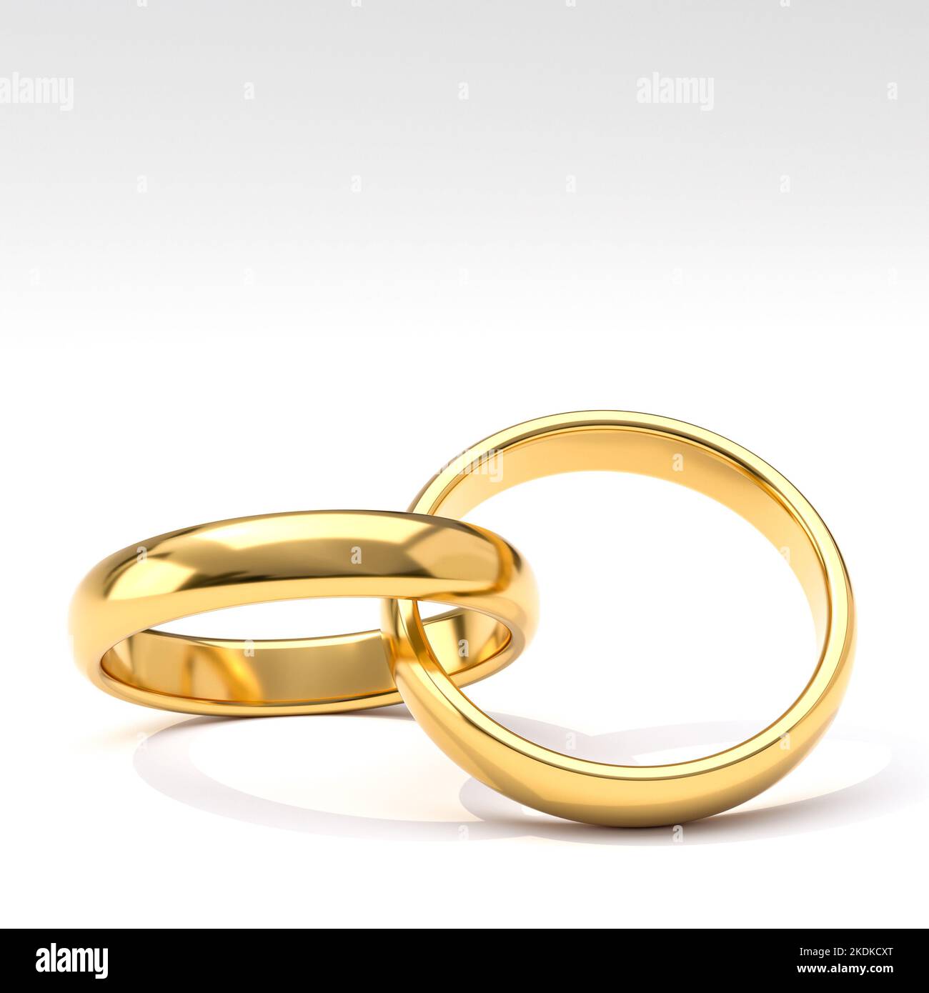 anillos de bodas de oro sobre un fondo blanco. presentación 3d Foto de stock